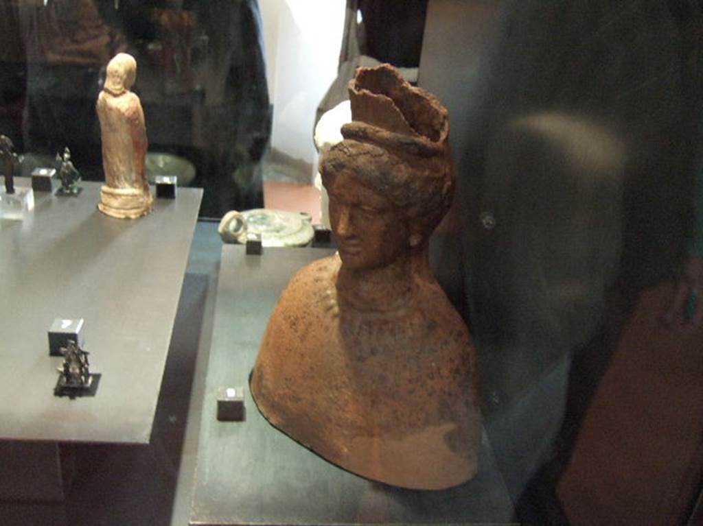 Terracotta bust of Isis found in I 2.17.  Now in Naples Archaeological Museum.