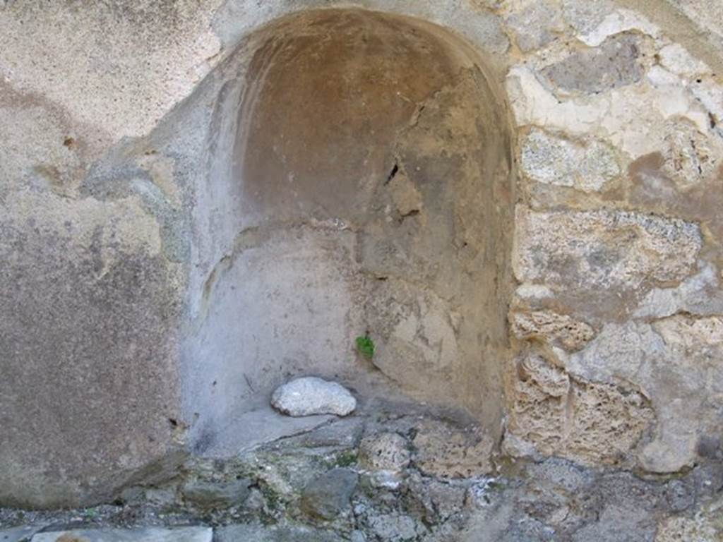 I.3.28 Pompeii. March 2009. Niche in south wall behind counter. Boyce described this as a semi-circular arched niche.
