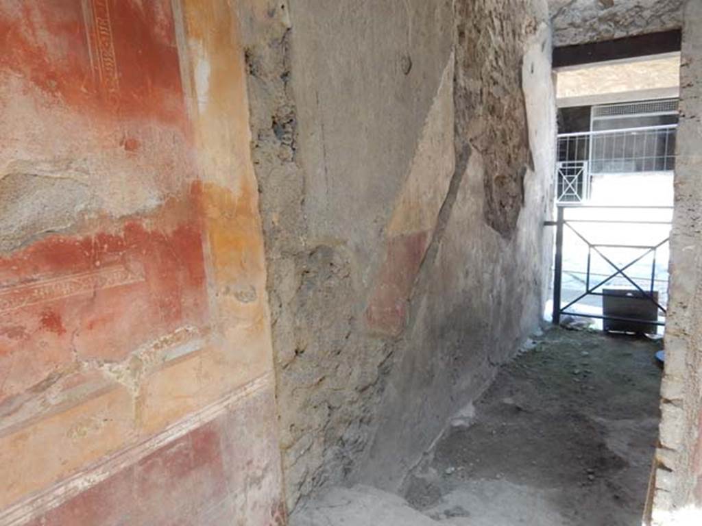 I.7.2/3 Pompeii. May 2016. Doorway  in north-west corner of atrium of I.7.3, leading north to entrance at I.7.2, steps to upper floor. Photo courtesy of Buzz Ferebee.

