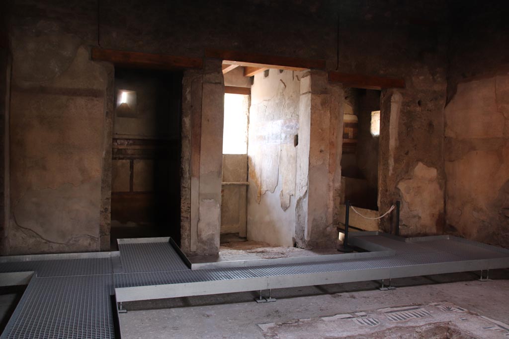 I.9.14 Pompeii. October 2022. 
Room 8, looking south in atrium towards doorway to room 13, on left, entrance corridor, in centre, and room 14, on right. Photo courtesy of Klaus Heese.
