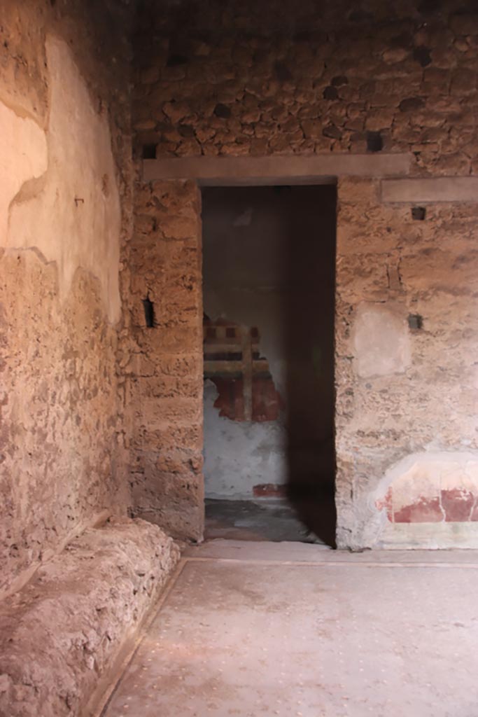 I.9.14 Pompeii. October 2022. 
Doorway to room 9, in north-west corner of atrium. Photo courtesy of Klaus Heese.
