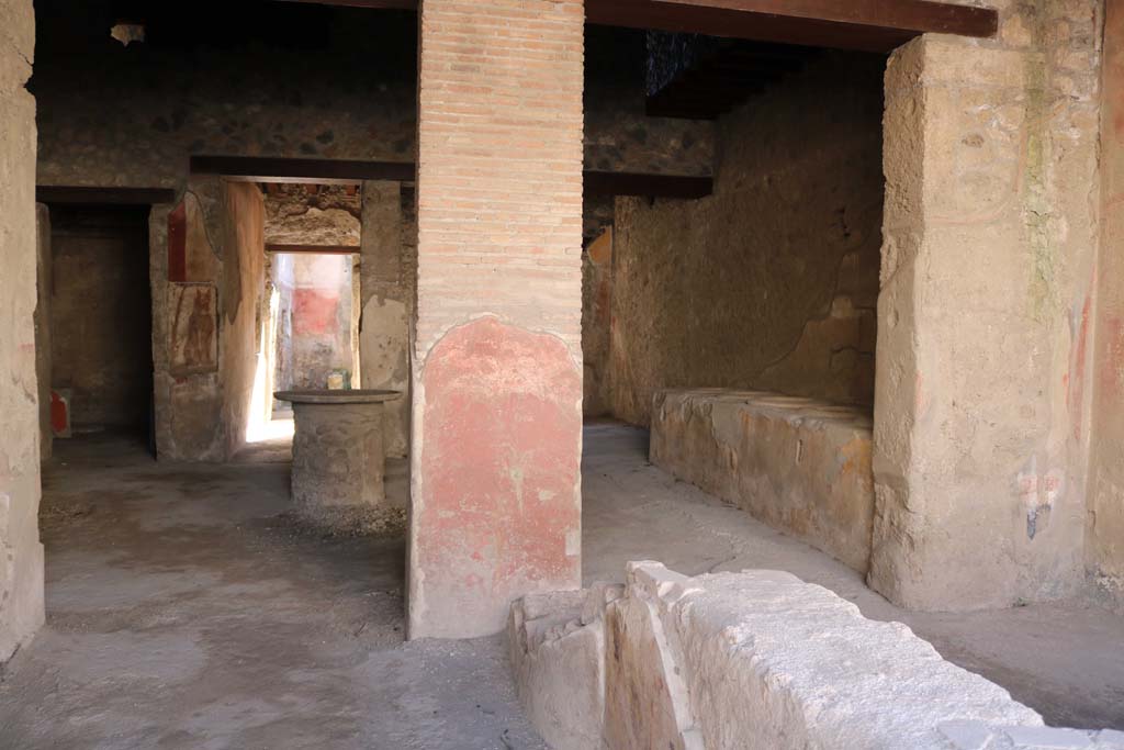 I.12.3 Pompeii. December 2018. 
Room 1, looking south across counter towards painted pilaster, and rear rooms. Photo courtesy of Aude Durand.
