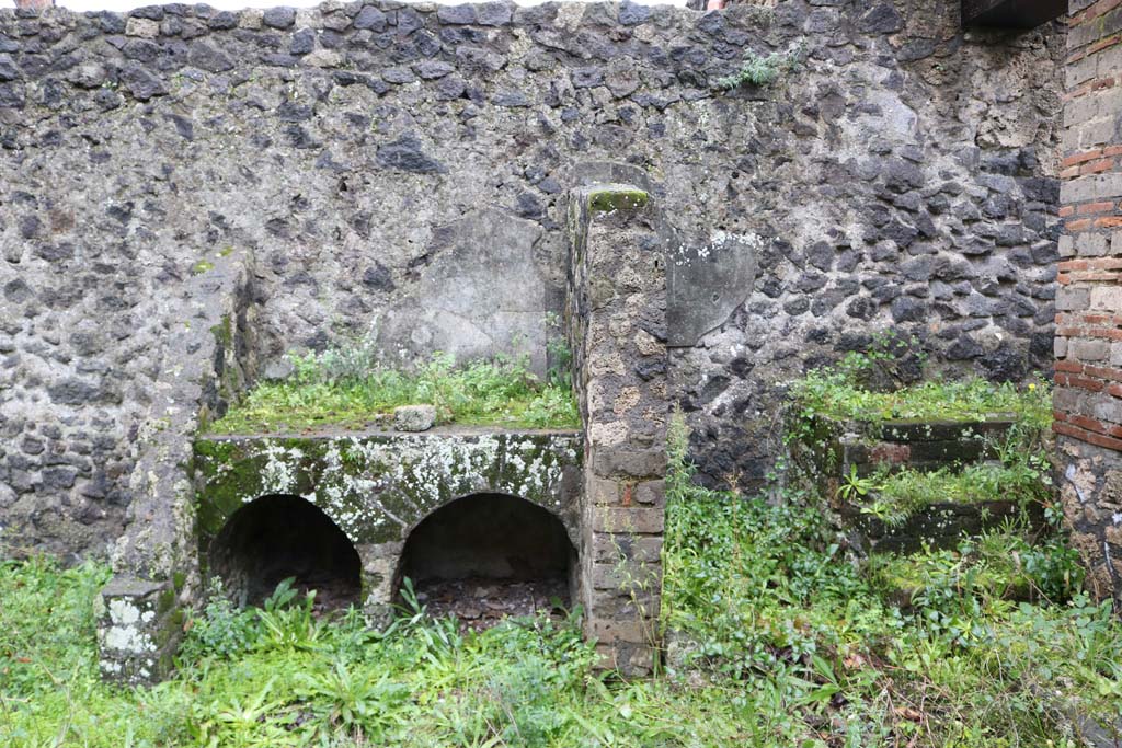 II.8.2 Pompeii. December 2018. Bench or hearth and steps against south wall. Photo courtesy of Aude Durand.
