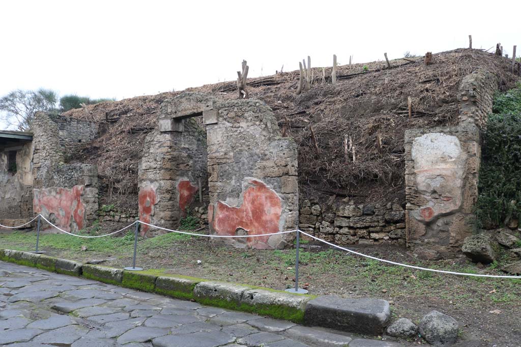 III.5.5 Pompeii, on right. December 2018. 
Looking west towards entrance doorways on north side of Via dellAbbondanza, with III.5.3, on left. Photo courtesy of Aude Durand.
