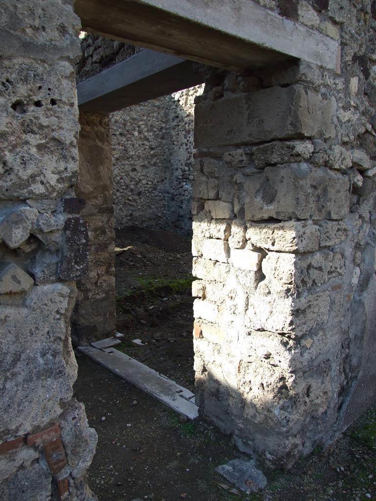 V.1.7 Pompeii. December 2007. Entrance to room 20, corridor, with door on right leading to room 24.