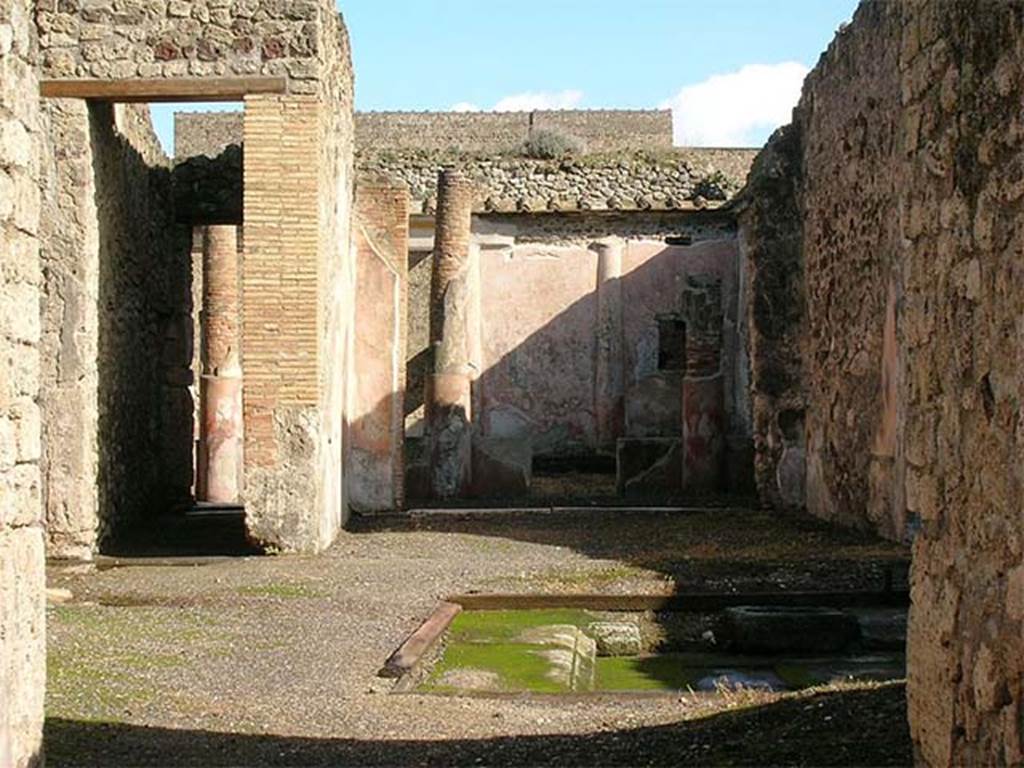 V.1.18 Pompeii. November 2012. Looking east across atrium “b” to tablinum “g”.
Photo Wikimedia, Courtesy of author Mentnafunangann. 
Use subject to a Creative Commons Attribution-Share Alike 3.0 Unported Licence
