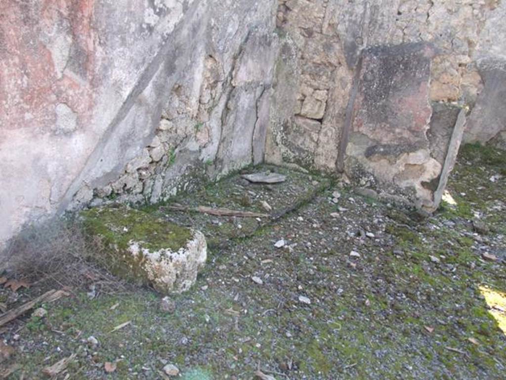 V.4.c Pompeii. March 2009. Base of stairs (c) to upper floor, in south-west corner of atrium B. According to Sogliano, leaning against the south wall would have been the wooden stairs that led to the upper floor, only the base remained. Under the stairs would have been a small storage area, with the traces of shelving. See Notizie degli Scavi, 1905, (p.131)