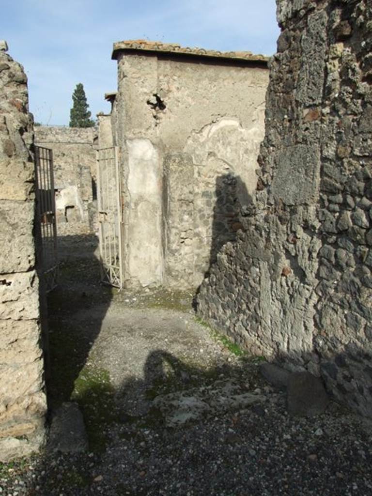 VI.1.7 Pompeii. December 2007. Looking north from room 36, into corridor and ahead into the secondary atrium. The doorway of room 32 is on the right.
