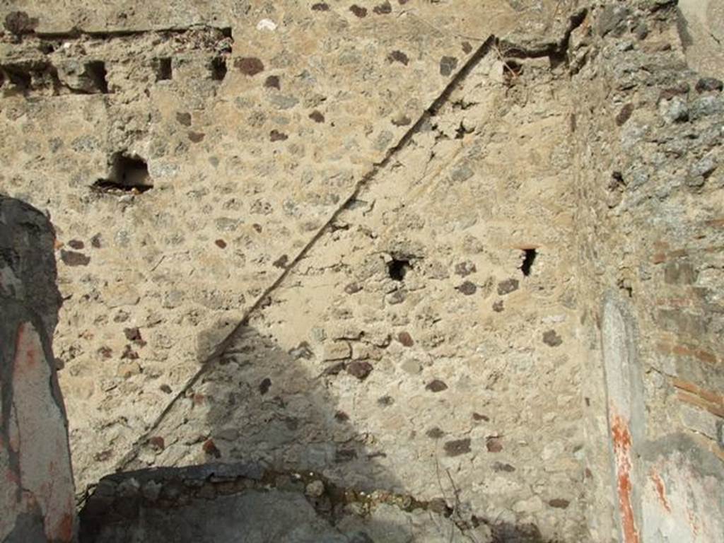 VI.5.8 Pompeii. September 2005. Line of staircase against north wall, and showing holes for beams supporting an upper floor.
