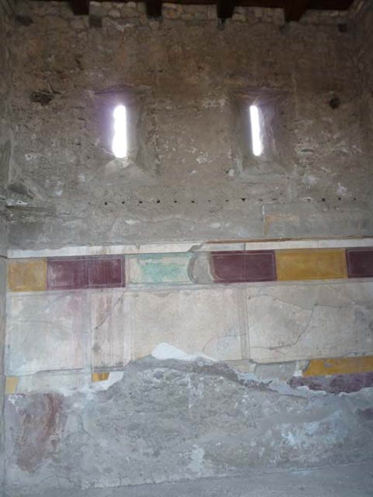 VI.12.2 Pompeii. September 2015. West wall of third room on west side of atrium, with windows in upper wall onto Vicolo del Fauno.