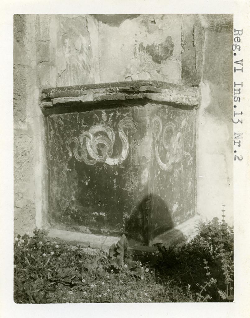VI.13.2 Pompeii. Pre-1937-39. Looking towards altar with serpents in stucco relief.
Photo courtesy of American Academy in Rome, Photographic Archive. Warsher collection no. 584a.

