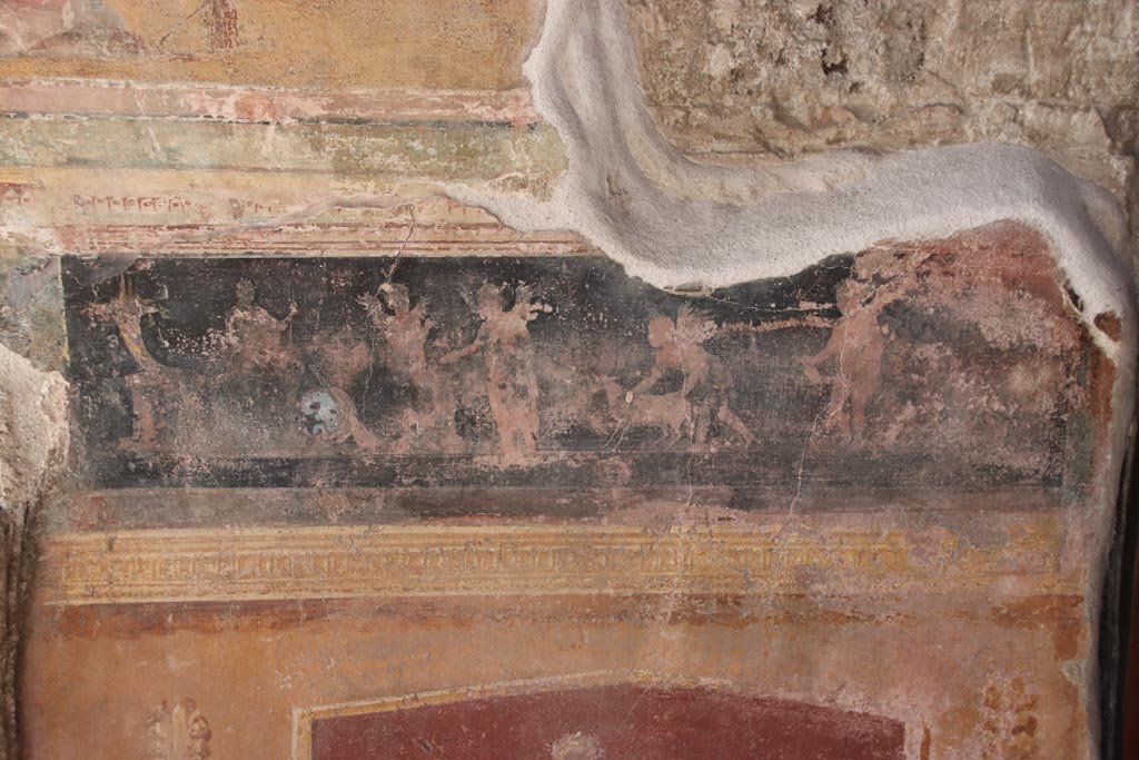 VI.15.1 Pompeii. October 2023. 
North side of atrium, detail of painted panel on east side of masonry base for strongbox. Photo courtesy of Klaus Heese.
