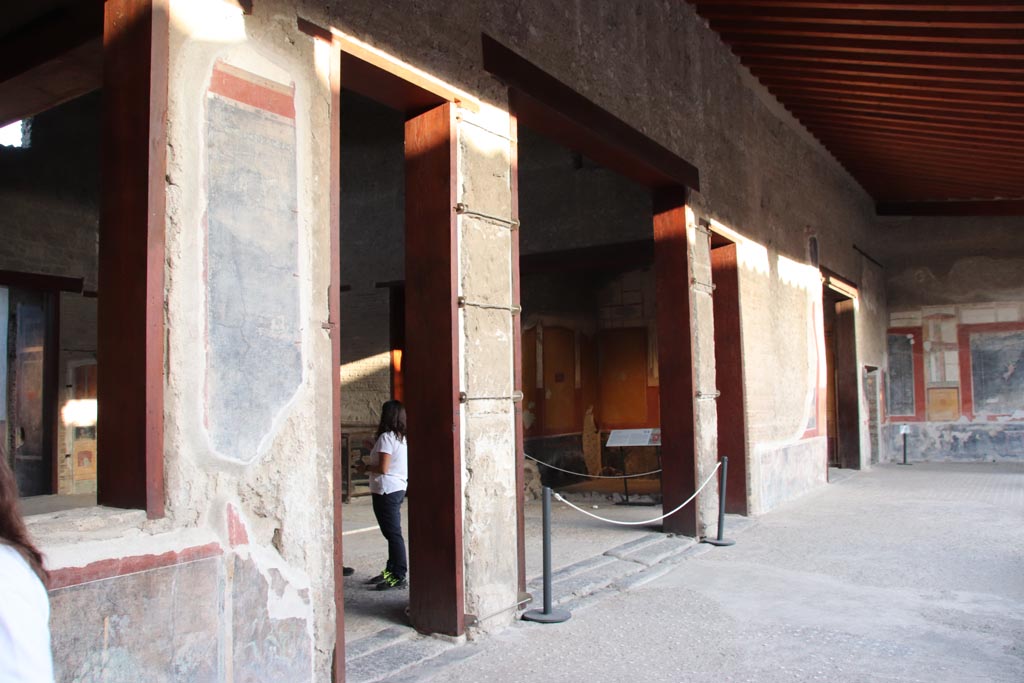 VI.15.1 Pompeii. October 2023. Looking south towards doorways to atrium from east portico. Photo courtesy of Klaus Heese.