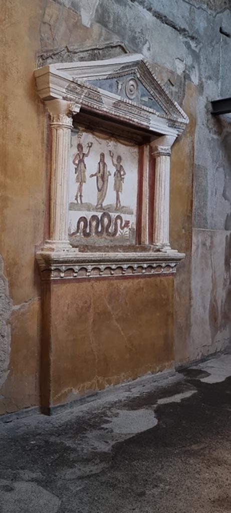 VI.15.1 Pompeii. January 2023. 
Household lararium on west wall in “services area”.
Photo courtesy of Miriam Colomer.
