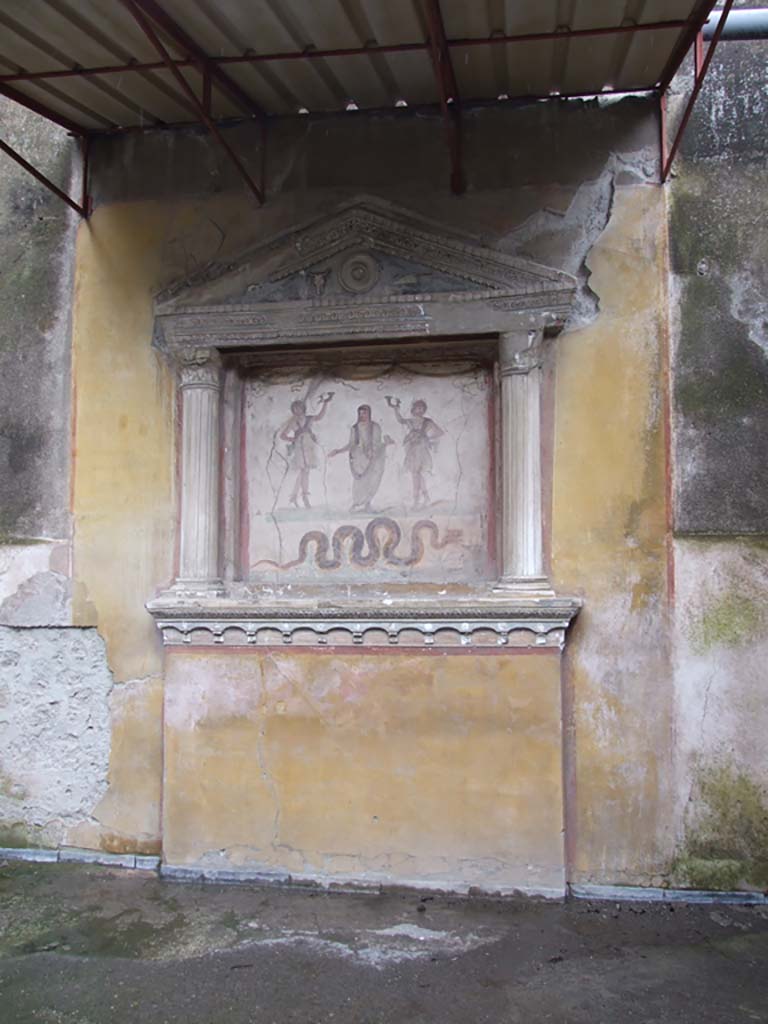 VI.15.1 Pompeii. December 2006. Household lararium on west wall in service area.
