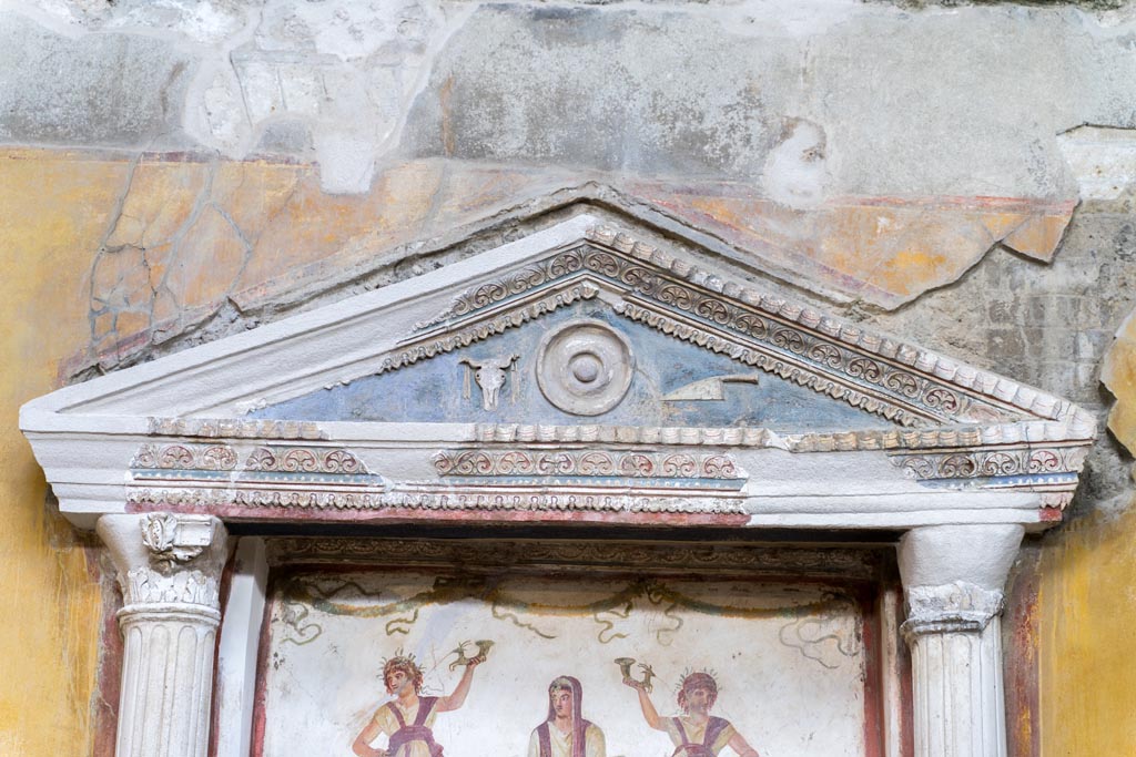 VI.15.1 Pompeii. March 2023. Detail of aedicula above lararium painting. Photo courtesy of Johannes Eber.