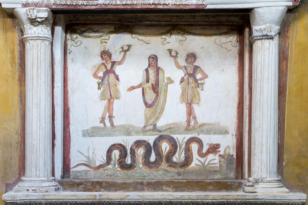 VI.15.1 Pompeii. March 2023. Lararium painting below aedicula. Photo courtesy of Johannes Eber.