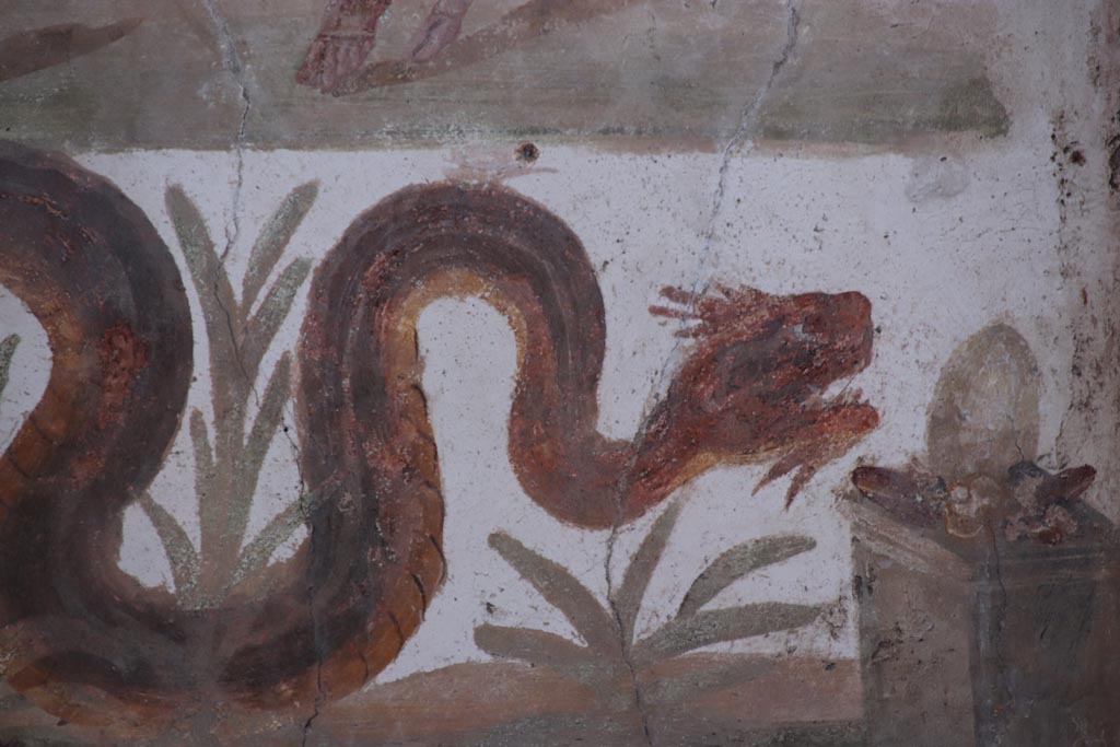 VI.15.1 Pompeii. October 2023. Detail of serpent on lararium painting gliding through plants towards altar. Photo courtesy of Klaus Heese.