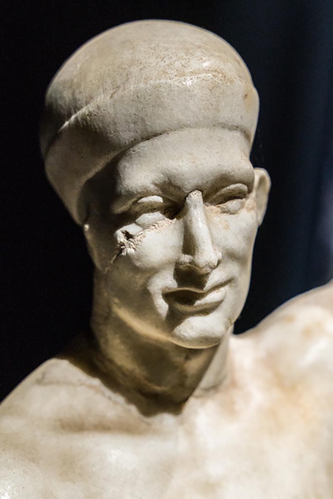VI.15.1 Pompeii. January 2023. 
Statue of Priapus, detail of face, on display in exhibition in Palaestra.
Photo courtesy of Johannes Eber.
