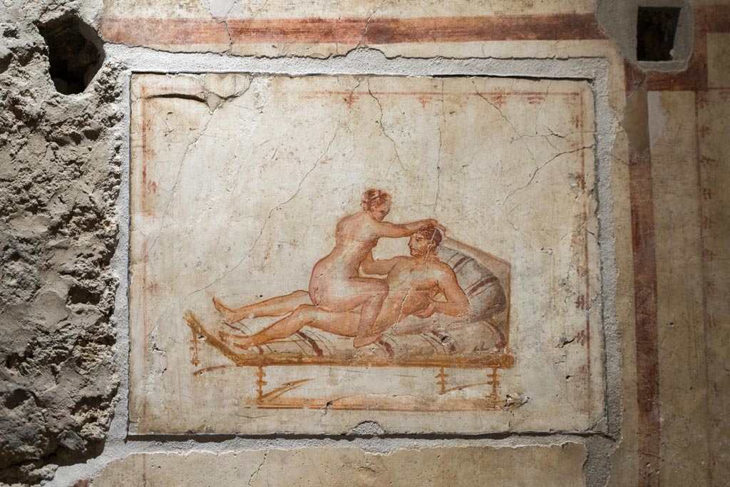 VI.15.1 Pompeii. March 2023. 
West wall, erotic painting in bedroom (x’), used either by servants or perhaps as a private brothel? Photo courtesy of Johannes Eber.

