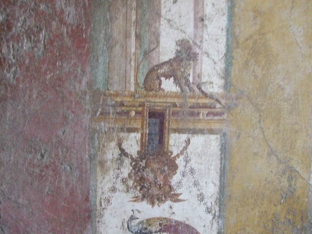 VI.16.15 Pompeii. December 2006. South end of west wall of room F. Architectural wall painting with panther, mask and peacock.