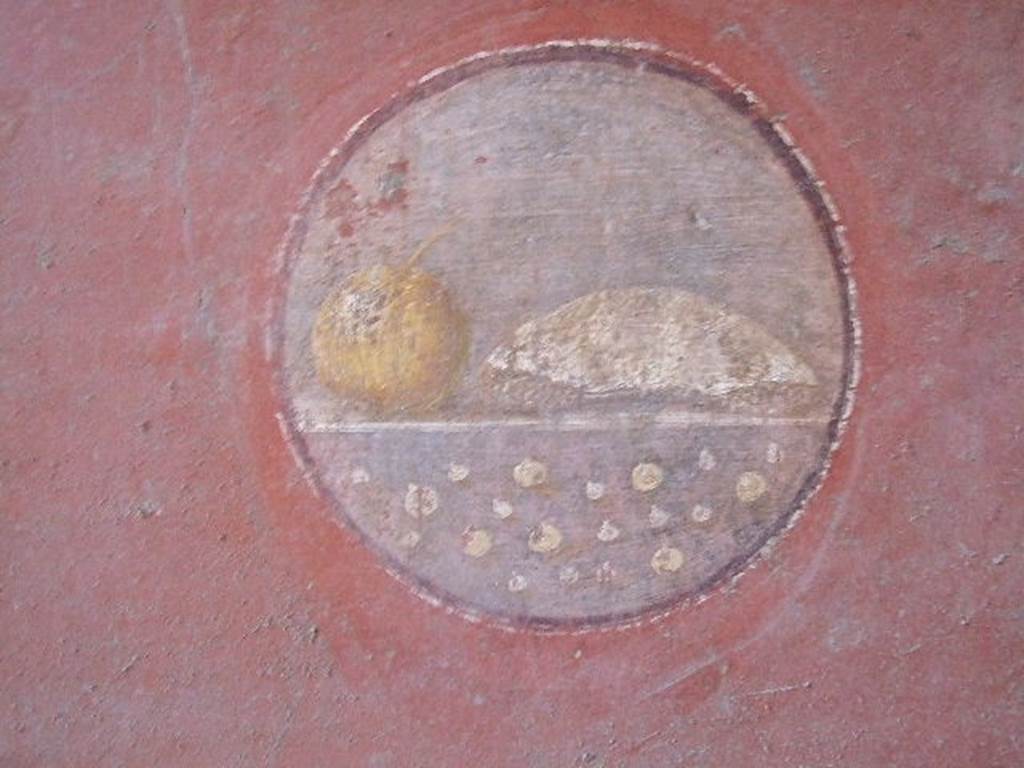 VI.16.15 Pompeii. December 2006. Medallion on south end of east wall of room F with painting of food.