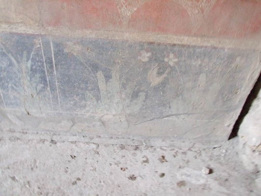 VI.16.15 Pompeii. December 2006. South end of base of east wall of room F with detail of wall painting of plants.