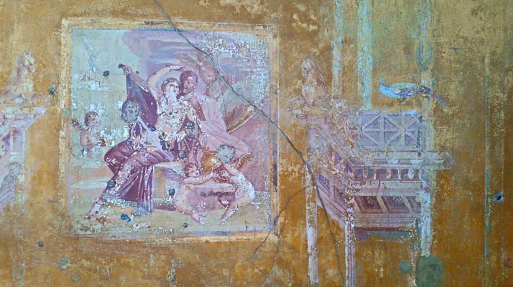 VI.16.15 Pompeii. 2015/2016. 
Central painting of Ares and Aphrodite (Mars and Venus) in a group with cupids playing with the weapons of the god. from north wall of room G. Photo courtesy of Giuseppe Ciaramella.
