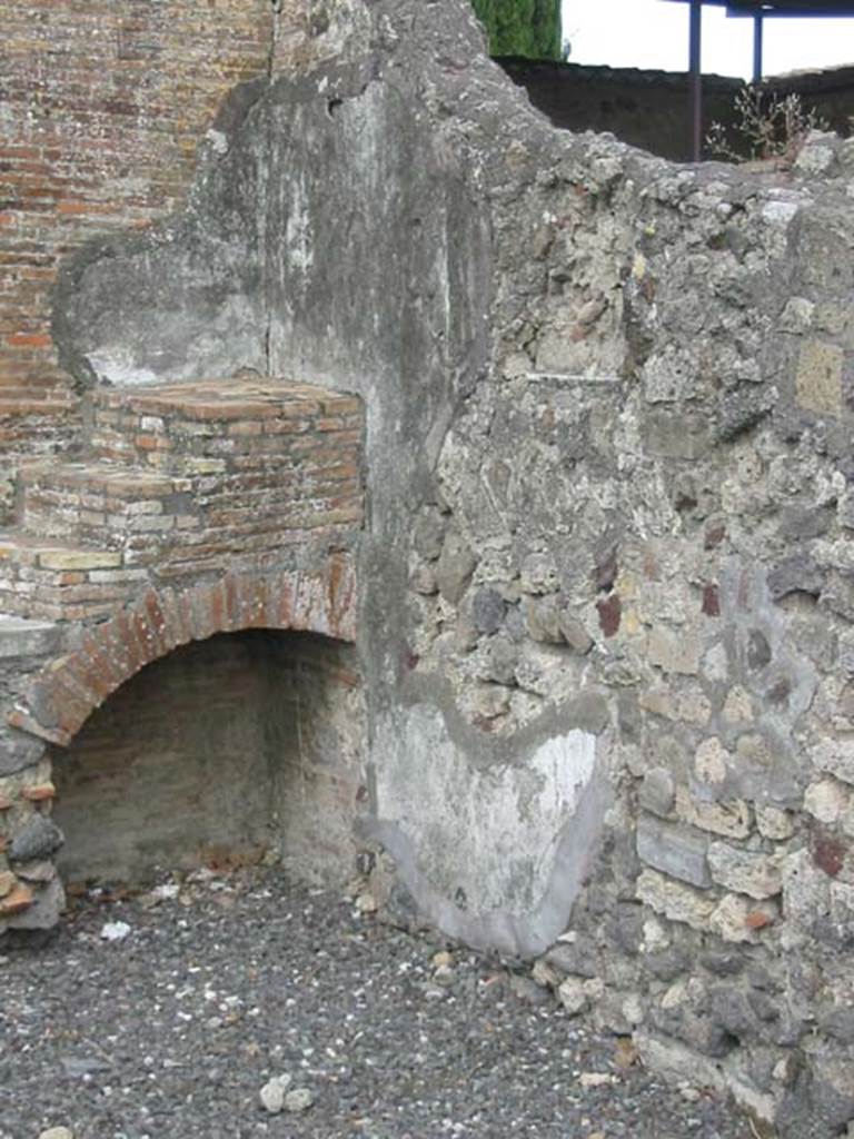 VI.17.4 Pompeii. May 2003. South-east corner of bar-room, with recess under display shelving. Photo courtesy of Nicolas Monteix.
