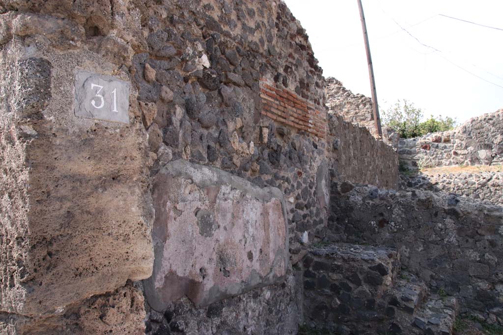 VI.17.31 Pompeii. September 2021. 
South wall of shop with remains of stone staircase in south-west corner, on right. Photo courtesy of Klaus Heese.
