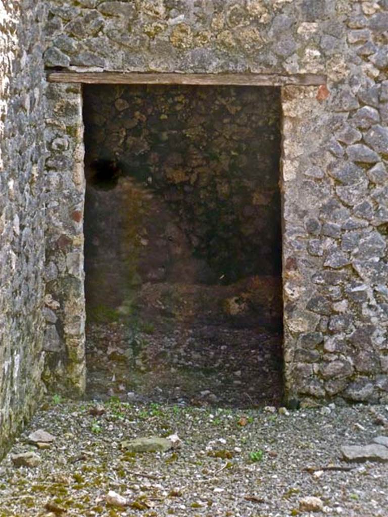 VI.17.37 Pompeii. May 2011. Doorway in west wall at lower level. Photo courtesy of Michael Binns.
