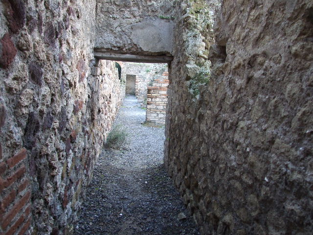 VII.1.8 Pompeii. May 2012. Corridor running south along rear of VII.1.52 to VII.1.58 on right. Photo courtesy of Buzz Ferebee.