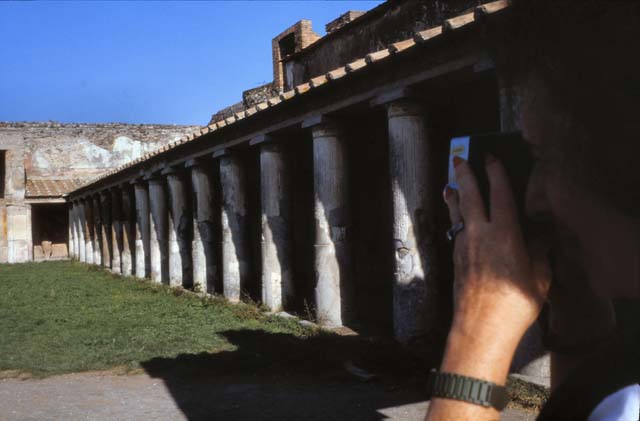 VII.1.8 Pompeii. December 2006. Corridor on east side of portico B, looking north.