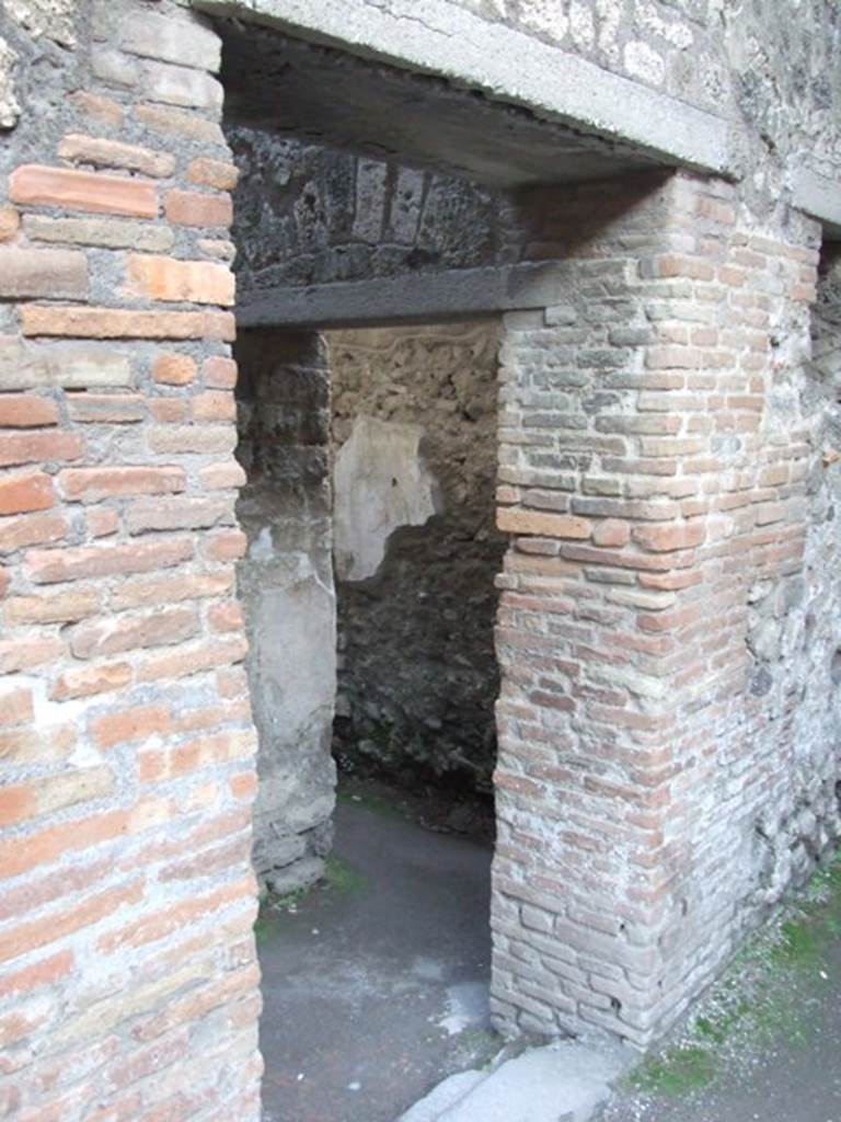 VII.4.48 Pompeii. December 2007.  Doorway to room 20, corridor leading from peristyle to entrance VII.4.43, with doorway to room 21 in south wall.
