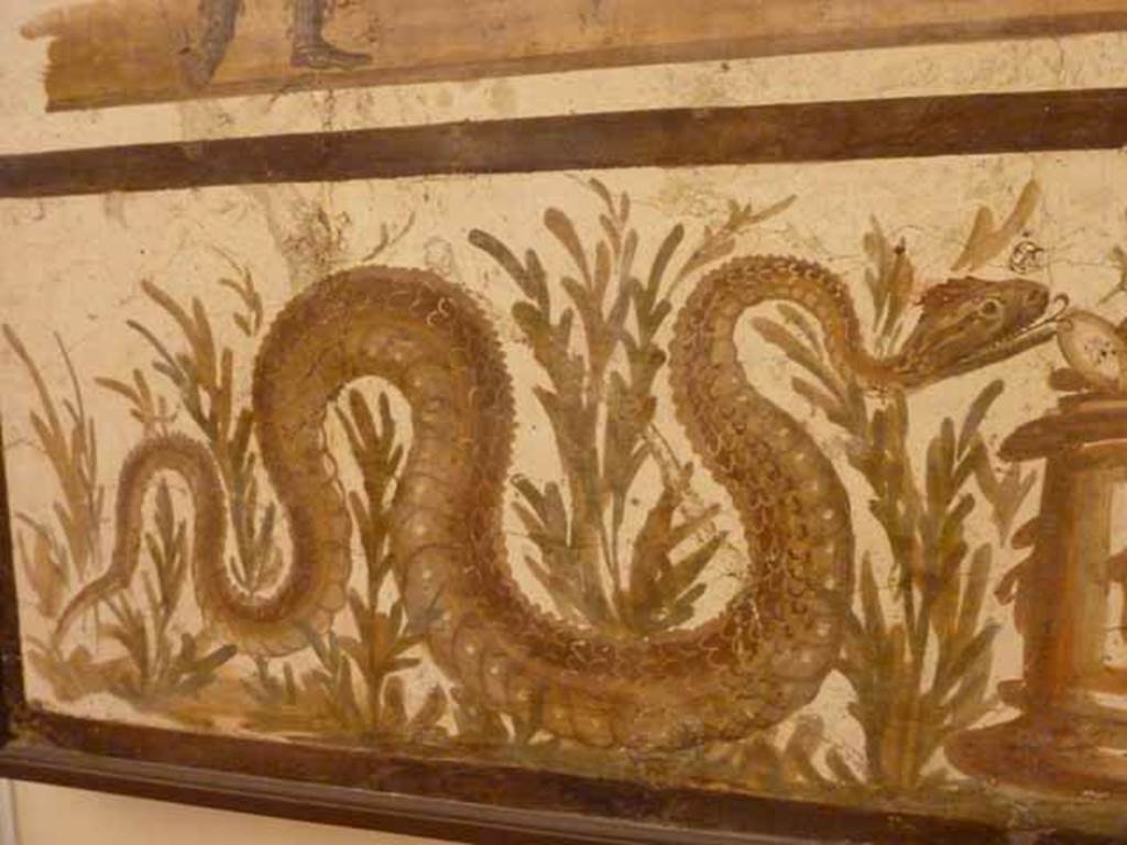 VII.6.38 Pompeii. Detail of serpent on left lower side. Now in Naples Archaeological Museum. Inventory number: 8905.

