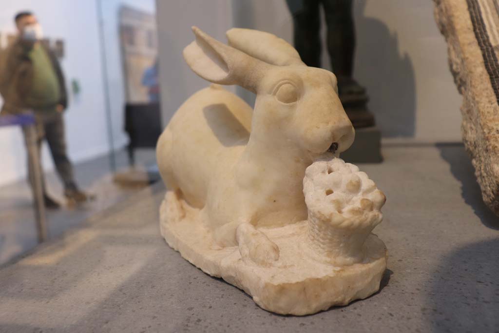 VIII.1.4 Pompeii. February 2021.  Found in area of Via del Vesuvio, Pompeii. 
Marble rabbit, found in front of a fountain. Photo courtesy of Fabien Bièvre-Perrin (CC BY-NC-SA).
