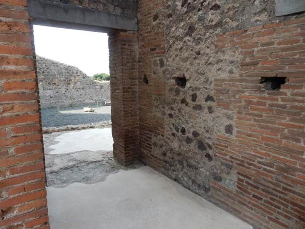 VIII.2.16 Pompeii. May 2017. Looking south along west wall in passageway towards large room. Photo courtesy of Buzz Ferebee.
