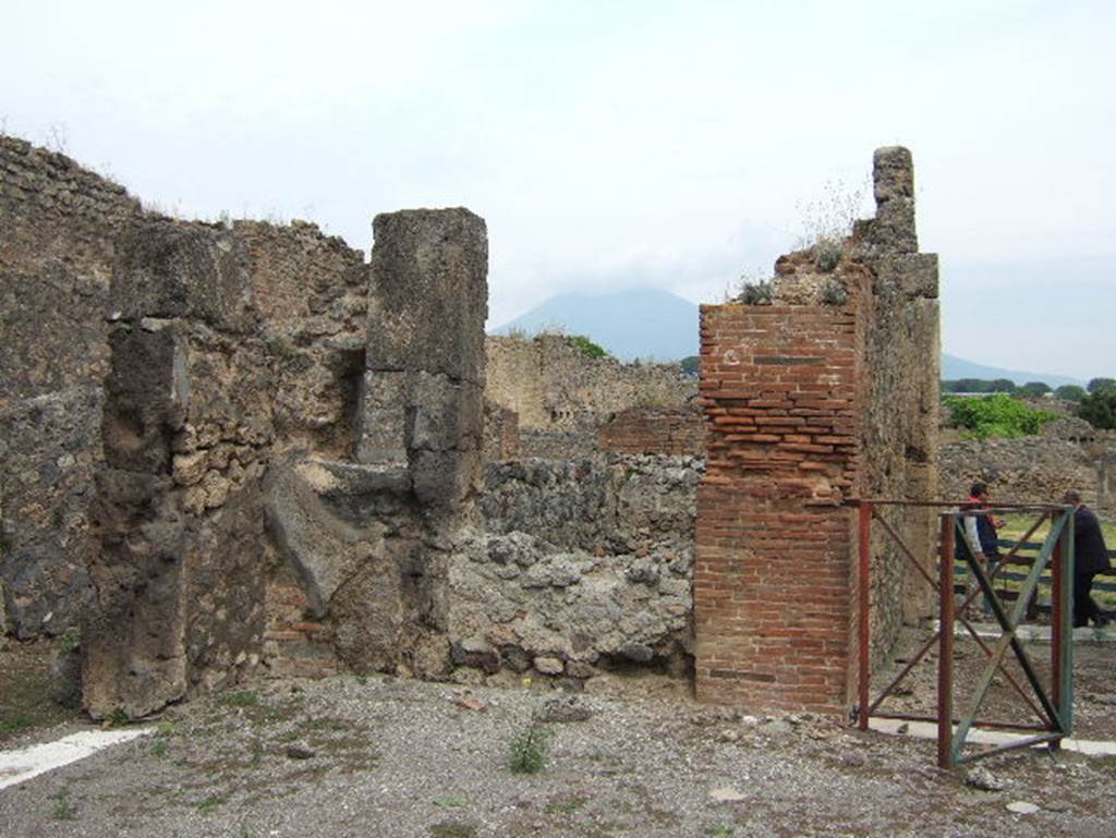 VIII.2.34 Pompeii. May 2006. Room in north-west corner of atrium. According to NdS, the kitchen was entered through the first doorway on the west side of the atrium. As well as the hearth and latrine, the kitchen also contained another rustic room that at one time was linked to the atrium. The posticum at VIII.2.33 was also near the kitchen. See Notizie degli Scavi, April 1885, (p.163)

