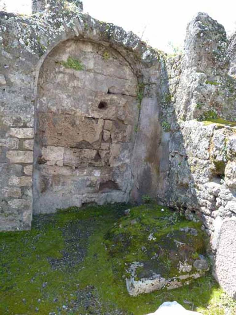 VIII.3.3 Pompeii. May 2010. West side of shop, with remains of stairs to upper floor against west wall.