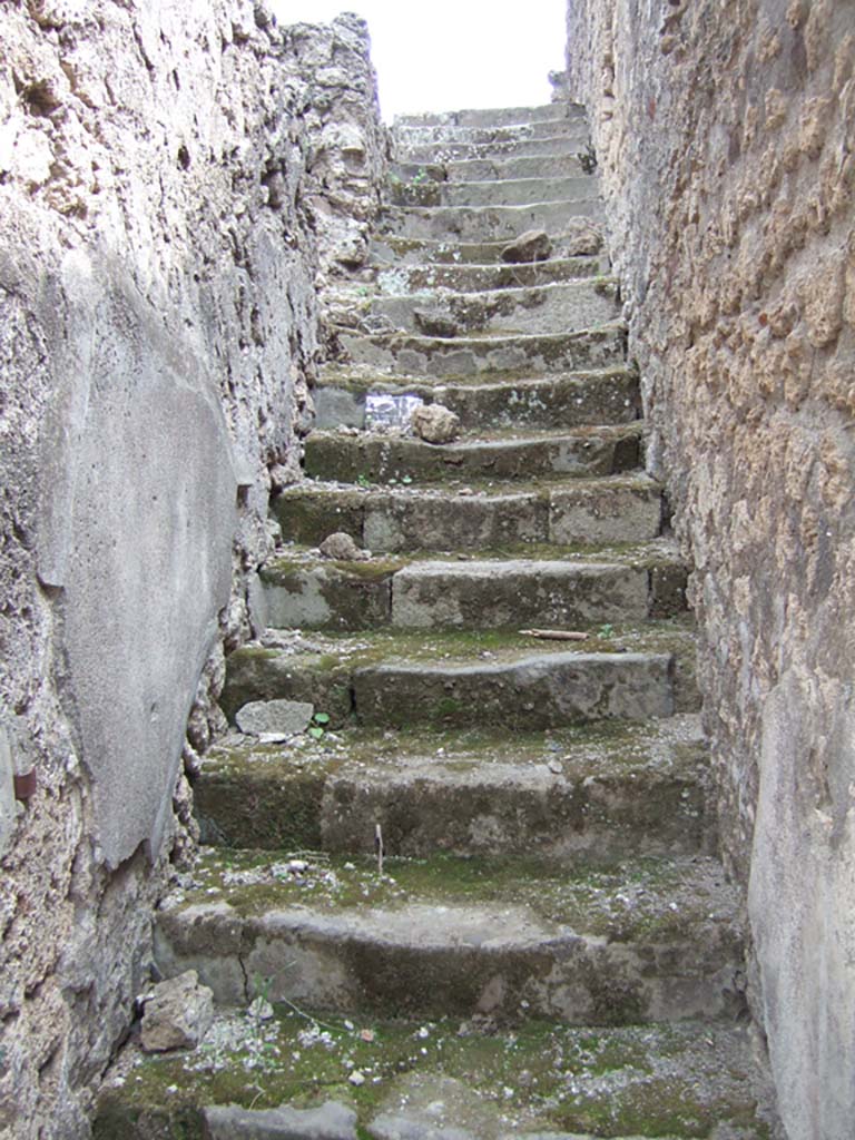 VIII.3.10 Pompeii. May 2006. Steps to upper floor with doorway on left to dwelling above VIII.3.11