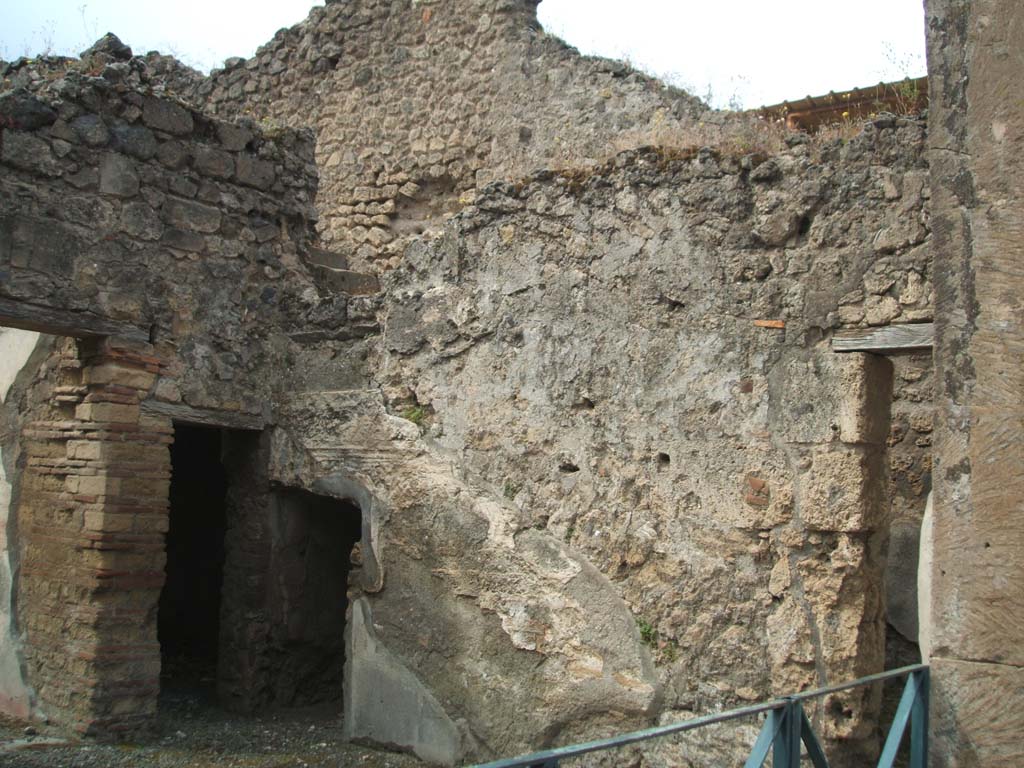VIII.3.11 Pompeii. May 2005. West wall, showing doorway (upper left centre) from stairs at VIII.3.10