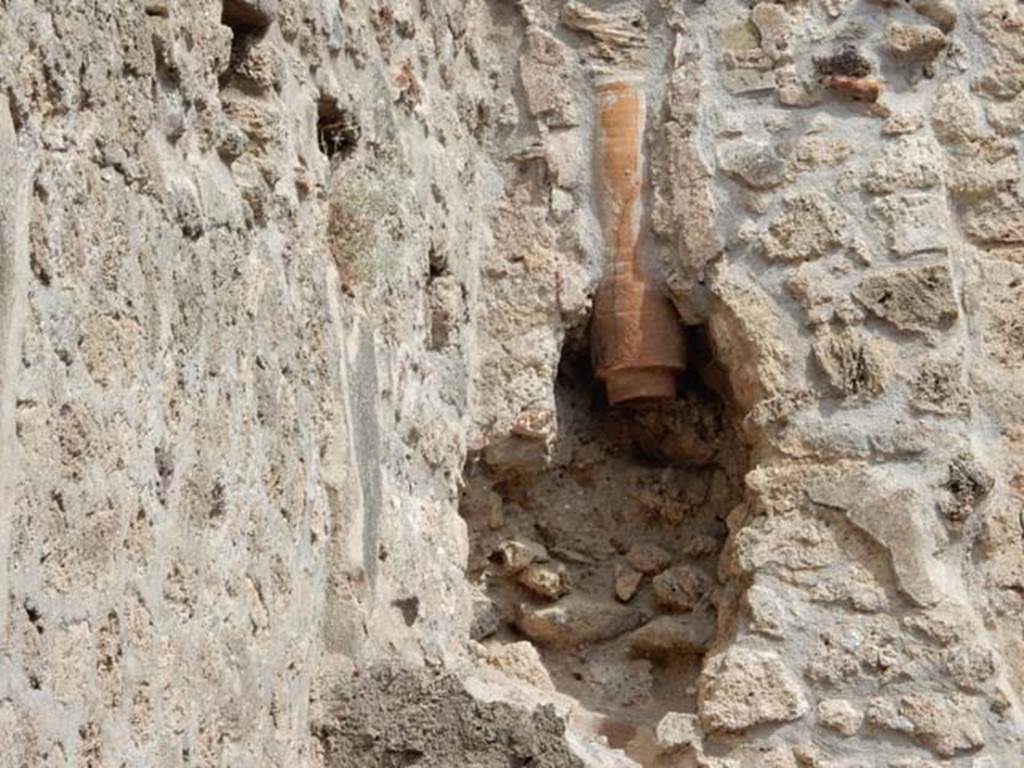 VIII.5.15 Pompeii. May 2017. Room 1, downpipe in north wall above stairs. Photo courtesy of Buzz Ferebee.
