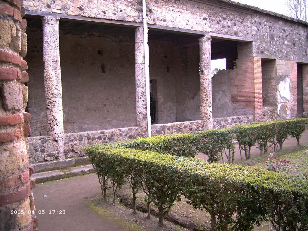 Villa of Mysteries, Pompeii. April 2005. The viridarium in the north-west corner. Looking south-west along the north portico of the garden.
Photo courtesy of Klaus Heese.
