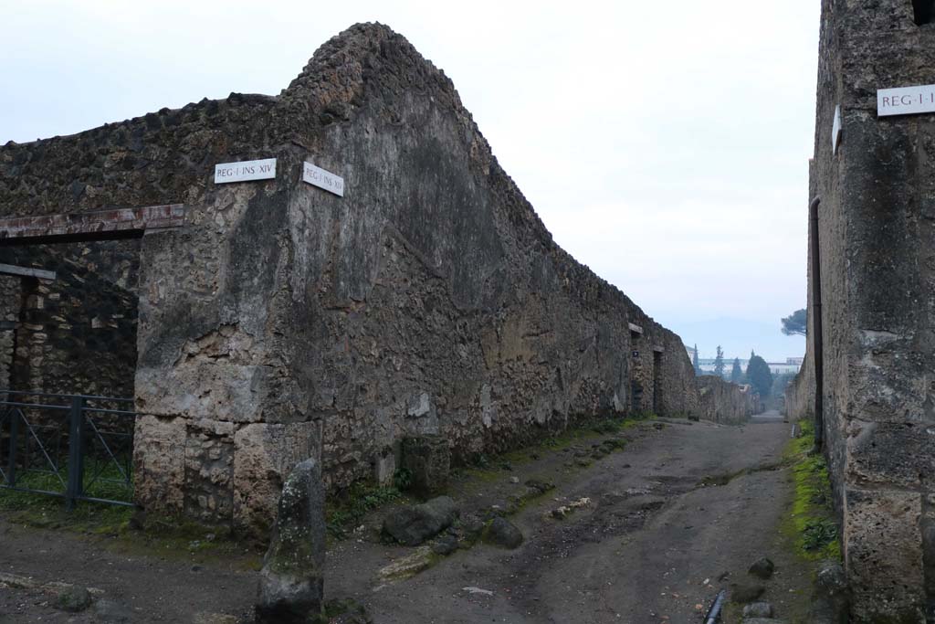 Vicolo dei Fuggiaschi, east side, Pompeii. December 2018. 
Looking south between I.14 and I.15, with I.14.8 on left. Photo courtesy of Aude Durand.

