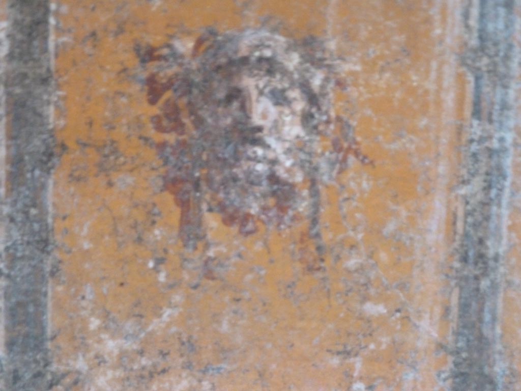 Stabiae, Villa Arianna, September 2015. Room 12, painted mask from panel in zoccolo of south wall.