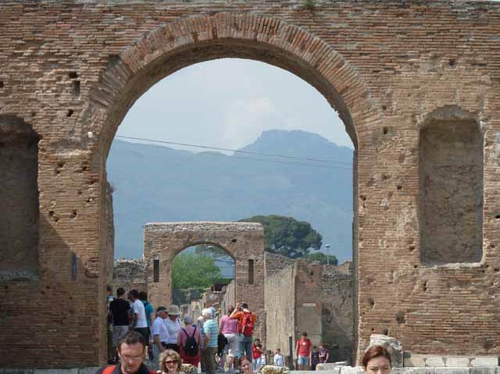 Arch of Caligula. May 2010. Looking north through arch at north-east end of the Forum, to the Arch of Caligula.