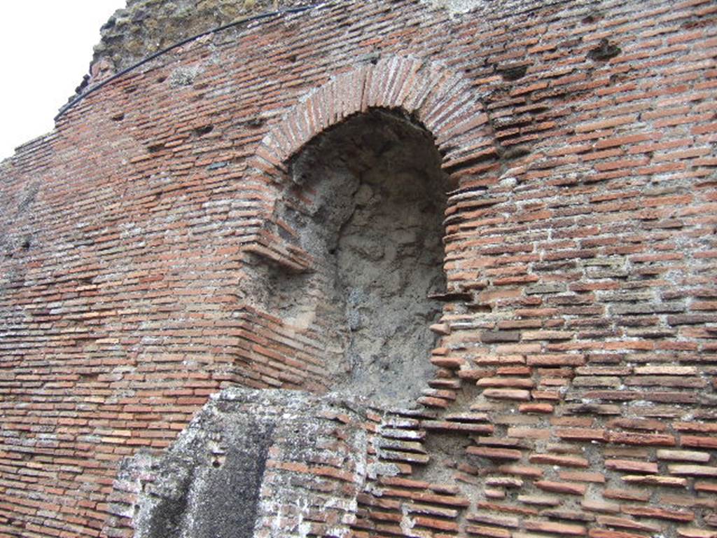 VII.5.8 Pompeii.  Side wall with remains of water tower. 