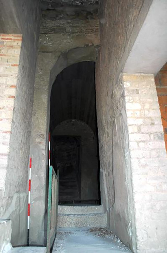 VII.16.17-22 Pompeii. 2014. Corridor with steps ahead with doorway to yellow room right and black room left.
This is the location of the Porta Occidentalis or Western Gate, originally with houses at each side but the house was built over it in Roman times.
Researchers at The University of Suor Orsola Benincasa discovered the presence of the Porta Occidentalis (posterula) with access to the city, aligned on an axis with via di Nola and Porta di Nola inside a contemporarily chronological arch ascribable to between III and II century BC. 

VII.16.17-22 Pompei. 2014. Corridoio con gradini avanti con porta alla camera gialla a destra e stanza nera a sinistra.
Questa  la posizione della Porta Occidentalis o Porta Occidentale, originariamente con case su ogni lato, ma la casa  stata costruita su di esso in epoca romana.
I ricercatori dell'Universit di Suor Orsola Benincasa hanno scoperto la presenza della Porta Occidentalis (posterula) con accesso alla citt, allineata su un asse con via di Nola e Porta di Nola allinterno di un arco cronologico coevo ascrivibile tra III e II secolo a.C.

Photograph  Parco Archeologico di Pompei.

https://www.identitainsorgenti.com/verso-il-4-maggio-due-nuove-scoperte-nel-sito-la-porta-occidentalis-e-il-santuario-fuori-le-mura/
