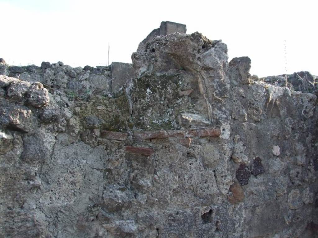 VII.13.7 Pompeii. December 2007. Walled up niche in east wall of shop.