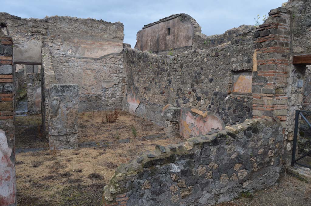 VII.15.12 Pompeii. March 2018. 
Looking north-east from garden area of VII.15.11, across to room described by Boyce as “central atrium-like room”.
According to Eschebach, it was a triclinium. 
Foto Taylor Lauritsen, ERC Grant 681269 DÉCOR.


